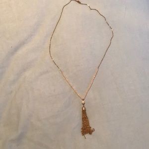 Long gold and pale pink necklace